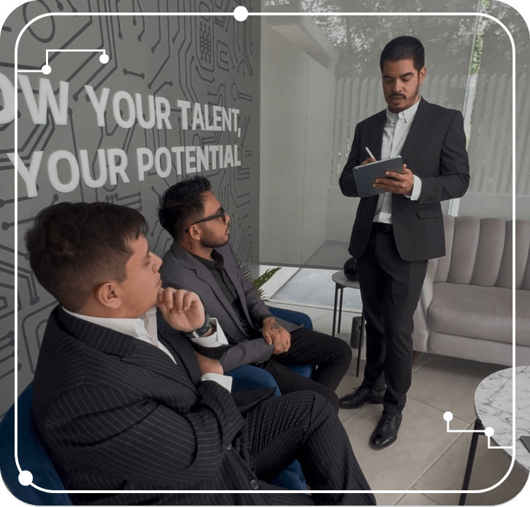 IT Seekers technical lead conducting a strategy and mentoring session with software engineers using a tablet in the corporate office.