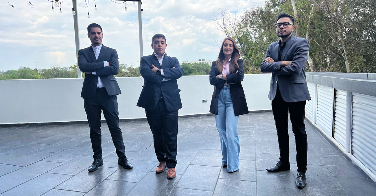 A diverse team of four IT Seekers professionals standing confidently on a modern corporate rooftop terrace, representing the company's elite nearshore talent pool.